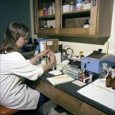 Woman Works with a Test Sample   (click for a larger preview)