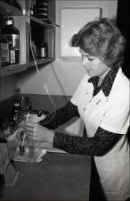 Woman Dilutes and Mixes in a Lab, number 1   (click for a larger preview)