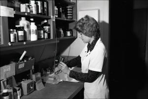 Woman Dilutes and Mixes in a Lab, number 2   (click for a larger preview)