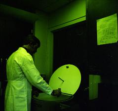 Man Places Sample into a Chamber Type Equipment, number 2   (click for a larger preview)