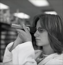 Laboratory Staff Looks Through Refractometer, number 2   (click for a larger preview)